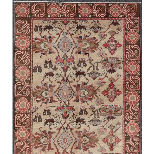 Produced in mid-20th century Turkey, this antique Oushak is characterized by a comely and highly representative Oushak...