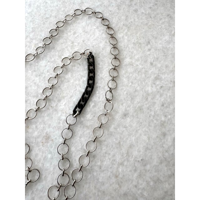 Boho necklace with silver and black chain and star shaped amethyst pendant