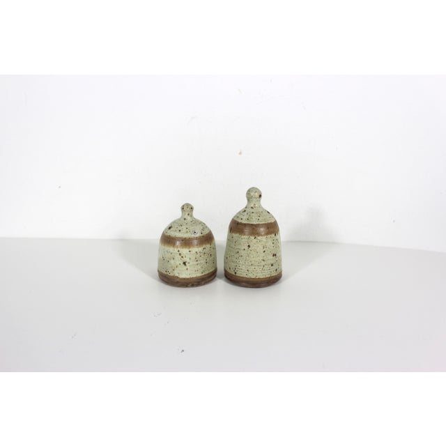 Vintage studio pottery speckled stoneware salt and pepper shakers. These are signed by the artist on the bottom. Please...