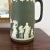 Listing is for a late 19th century Wedgwood jasperware upright pitcher in the less common olive green. The pitcher has the...