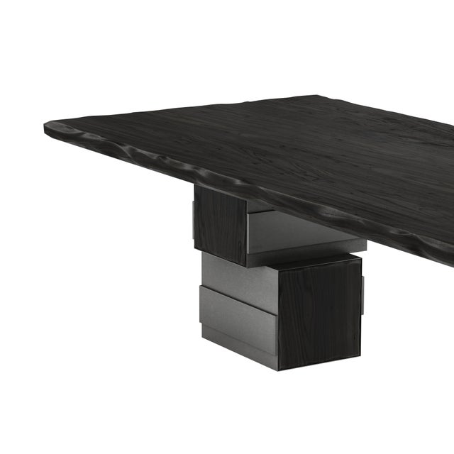 Born from the tectonic depths of Pennsylvanian geology, the Anthracite Dining Table captures the rare, obsidian-like...