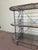 Unique low profile French Baker's Rack. Iron and Brass with 3 tiers of glass lined shelving. A lot of surface space for...