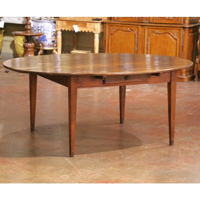 Crafted in France circa 1870, this elegant farmhouse table is a fine example of Louis Philippe period craftsmanship. Built...