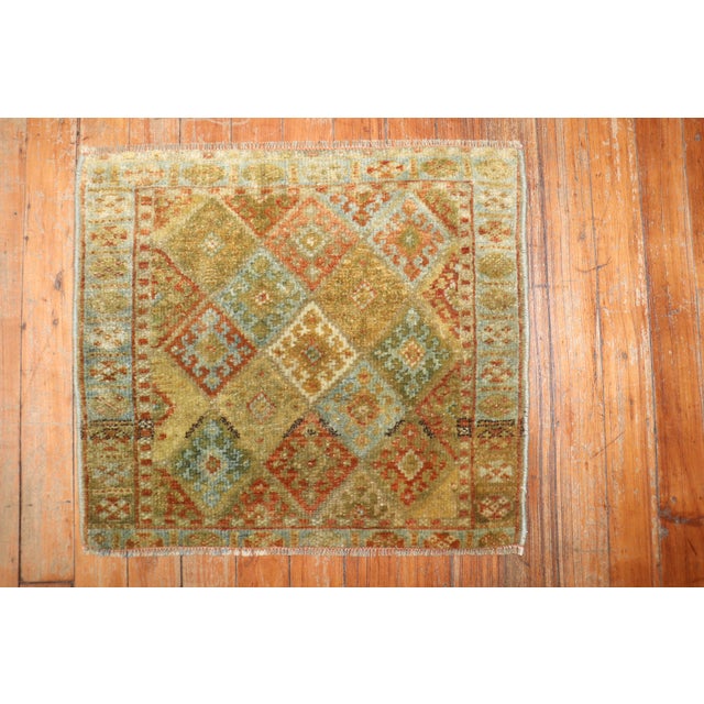 An early 20th century mini size Kurd Jaff rug Measures: 1'6" x 1'8".