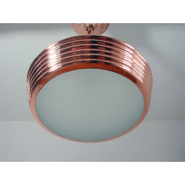 This vintage Art Deco Saturn style lamp was designed and manufactured in France in the 1930s. The lamp is made of copper...