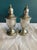This classic pair of vintage sterling silver weighted salt and pepper shakers brings refined beauty to any dining...