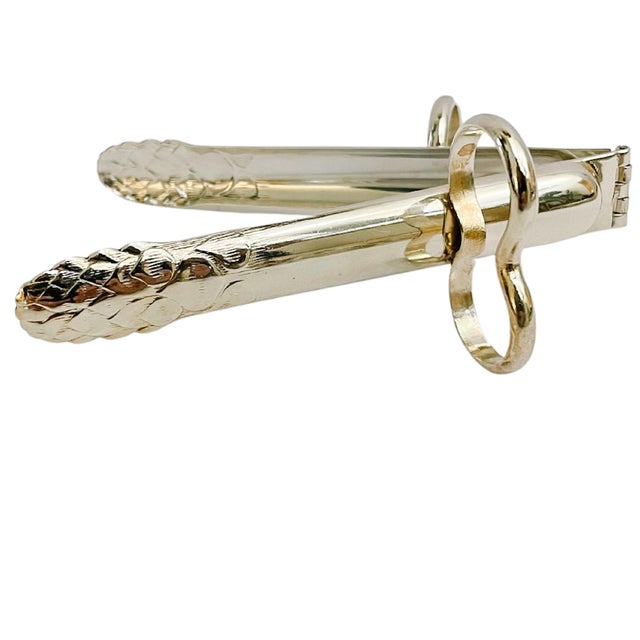 A fantastic set of six silver plated individual asparagus tongs / servers with embossed asparagus shaped ends and finger...