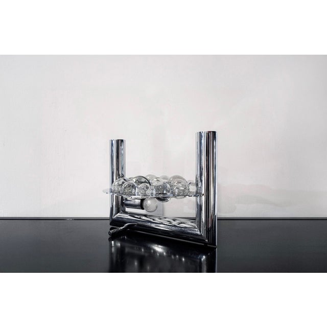 Table lamp in chromed steel and glass globes. Manufacturer Reggiani 1970s I have official proof of authenticity such as...