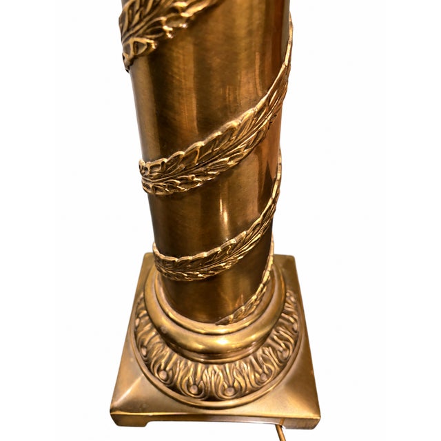 Heavy brass column table lamp in a neoclassical style, featuring decorative leaf detailing and a square base. The original...