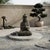 24" Distressed Black Brown Cross Legs Peaceful Hands Stone Buddha Statue For Sale - Image 4 of 13