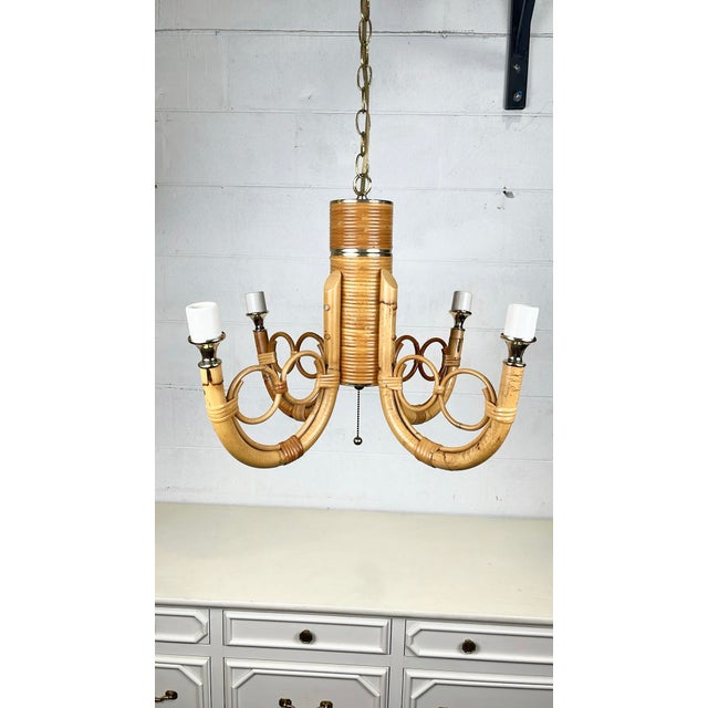 Vintage bamboo rattan 4 arm chandelier. Thick curved rattan arms with pencil reed rattan ring details. Cane wrapped joints...