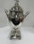 Antique English silver tea urn with square pedestal base with ball feet and finial at top. Transformed into a table lamp...
