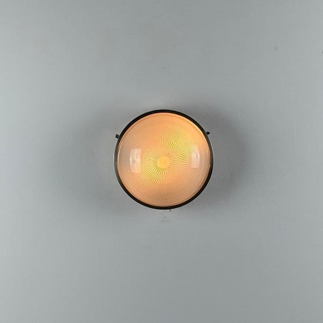 An iconic “Sigma” ceiling or wall light designed by Sergio Mazza for Artemide in the 1960s, a refined expression of...