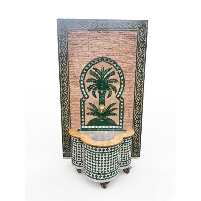 This exquisite wall fountain is a masterful example of traditional Moroccan craftsmanship, handcrafted in the historic...
