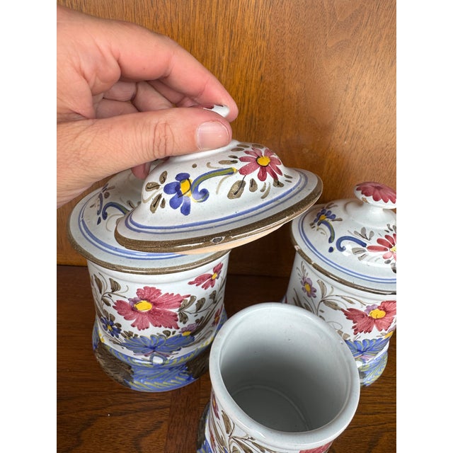 Add rustic elegance and timeless color to your kitchen with this vintage hand-painted ceramic canister set, featuring a...