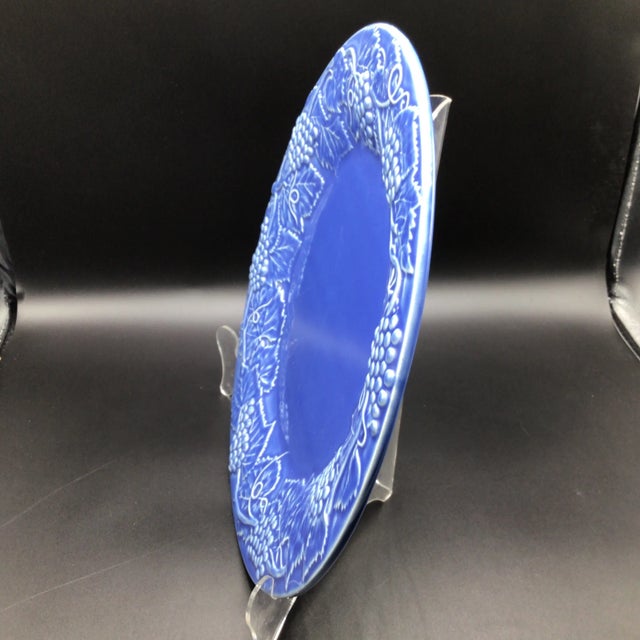 Rich blue 14 inch chop plate/serving platter with grape leaf boarder by Bordallo Pinheiro.