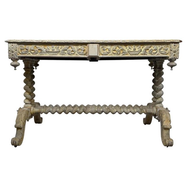 An exceptional 19th-century English Victorian writing table, beautifully crafted in carved oak and distinguished by its...