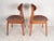Wonderful pair of vintage modern chairs with curved wing style back rests and contoured seats. Sturdy Danish design with...