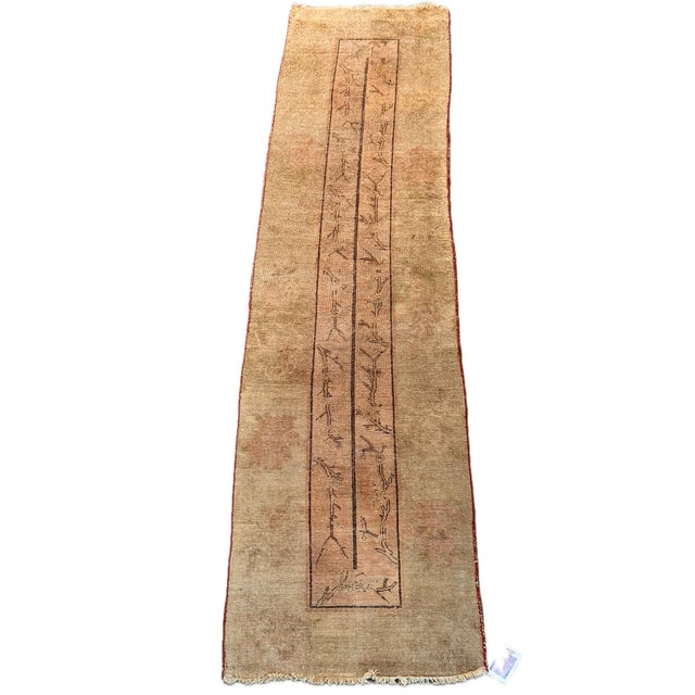Dating to the early 1900s, this antique Samarkand rug is distinguished by its highly individual central composition and...