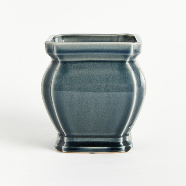 In a traditional coveted silhouette, this pot has a regal charm. Finished with a rich, blue reactive glaze, it is a...