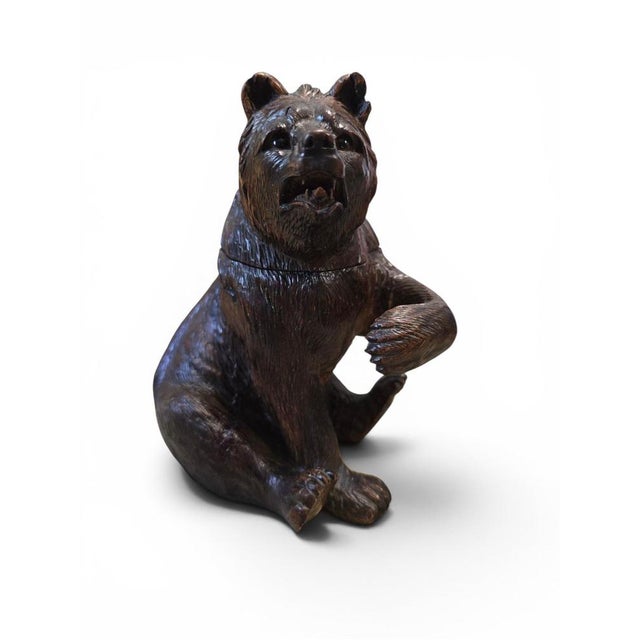 A charming and highly decorative 19th-century Black Forest carved wooden bear inkwell, finely hand-carved and retaining...