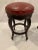 Rich Italian embossed leather bar stools in a marvelous orange red color, having large copper nail heads embellishing the...
