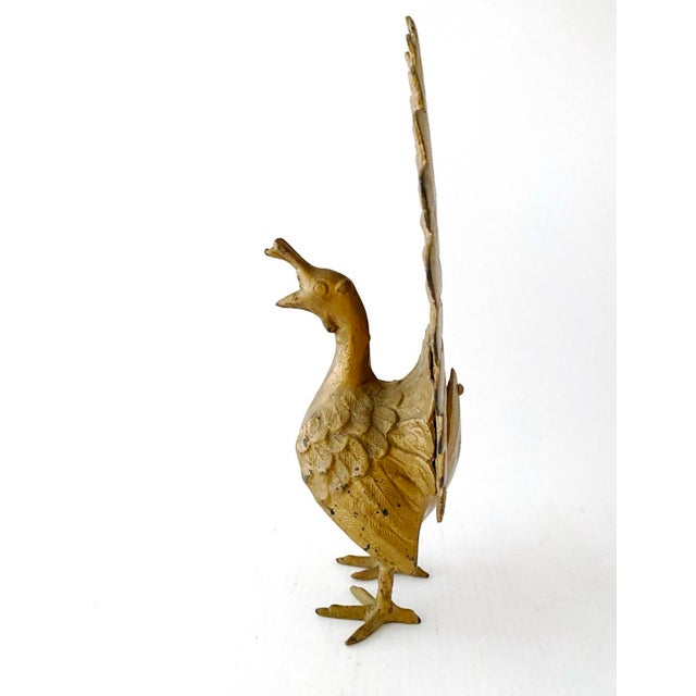 Here is a large vintage peacock, iron metal and gold-painted. 15 inches tall and 12 inches wide, heavy at over 6 pounds....