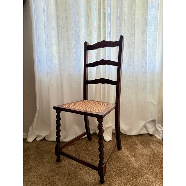 Beautiful Antique Jacobean-style barley twist side chair featuring a richly detailed carved wood frame and classic woven...