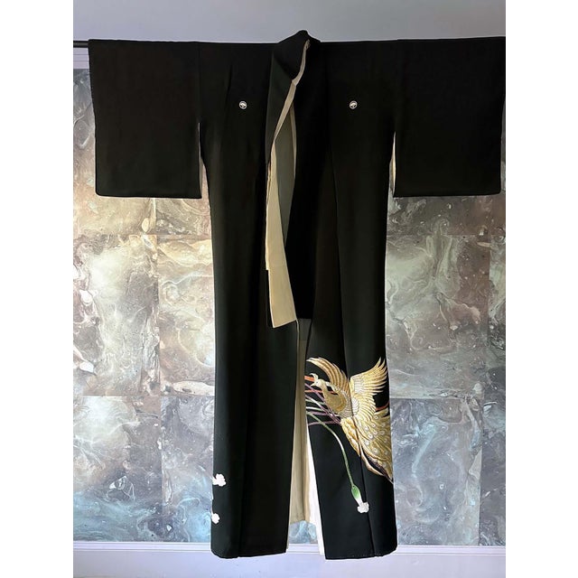 A vintage Japanese silk Kuro Tomesode Kimono, circa 1950s-1980s. Kuro Tomesode is a dress for married woman for the most...