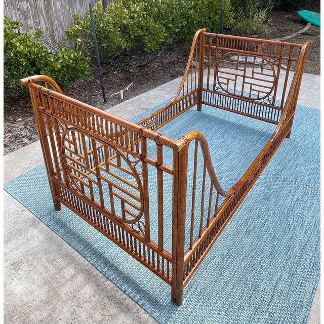 Mid century style twin size sleigh bed featuring Chinoiserie style fretwork and leather bindings. Constructed of a...