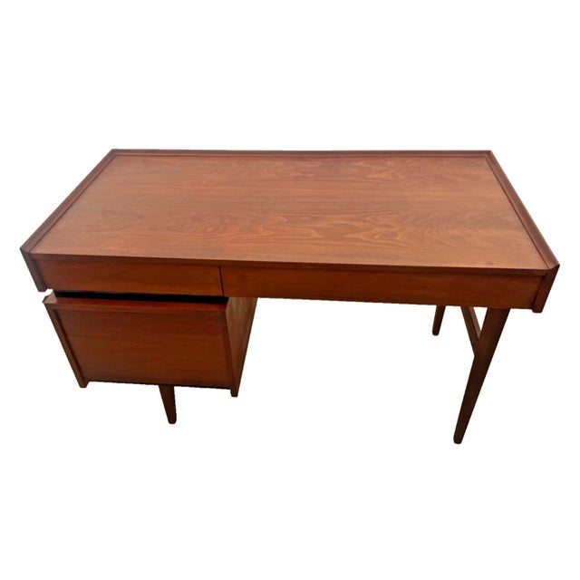 Elevate your home office or workspace with this iconic mid-century modern walnut desk, expertly crafted by the Dillingham...