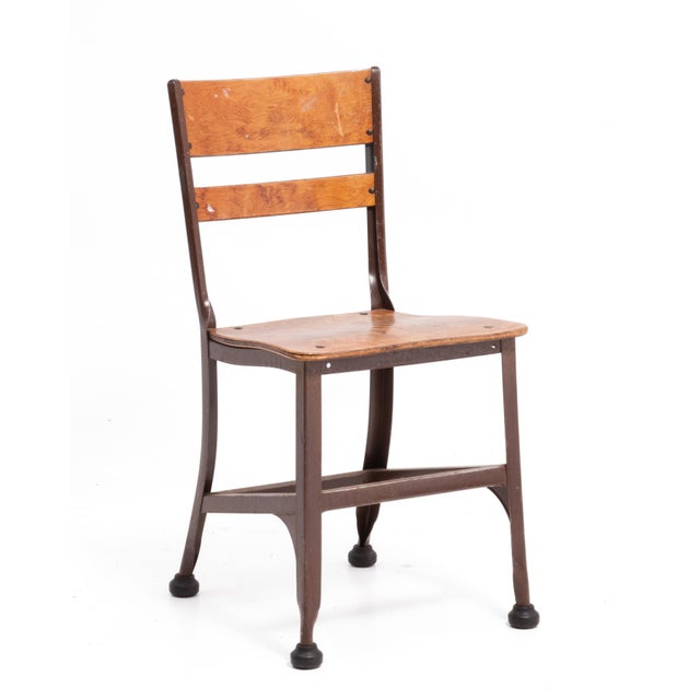 A set of four all original Toledo Metal Furniture Company steel and plywood dining chairs. All four chairs retain all four...