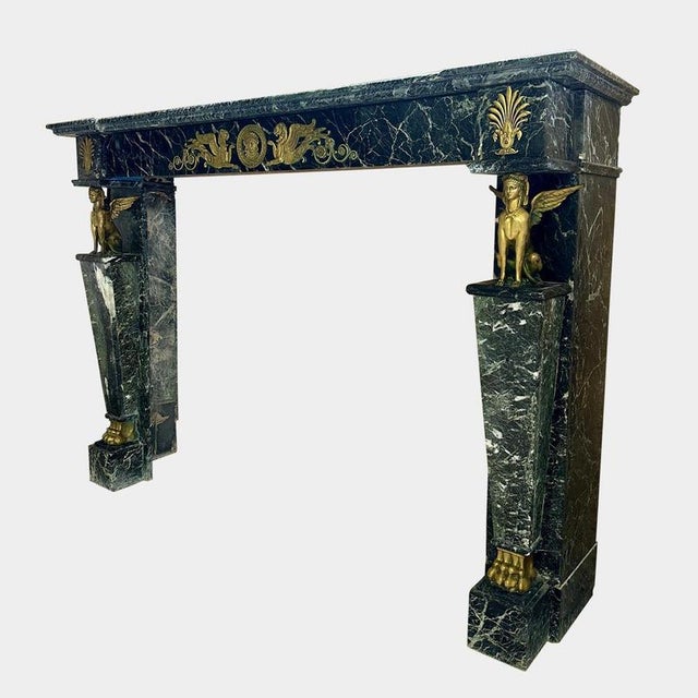 A large and very well decorated French Empire Egyptian Revival fireplace surround, in well configured Antico Verde Marble...
