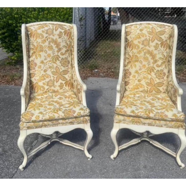 Vintage matched pair of Sam Moore wingback armchairs in a French Provincial style. These substantial high-back chairs...