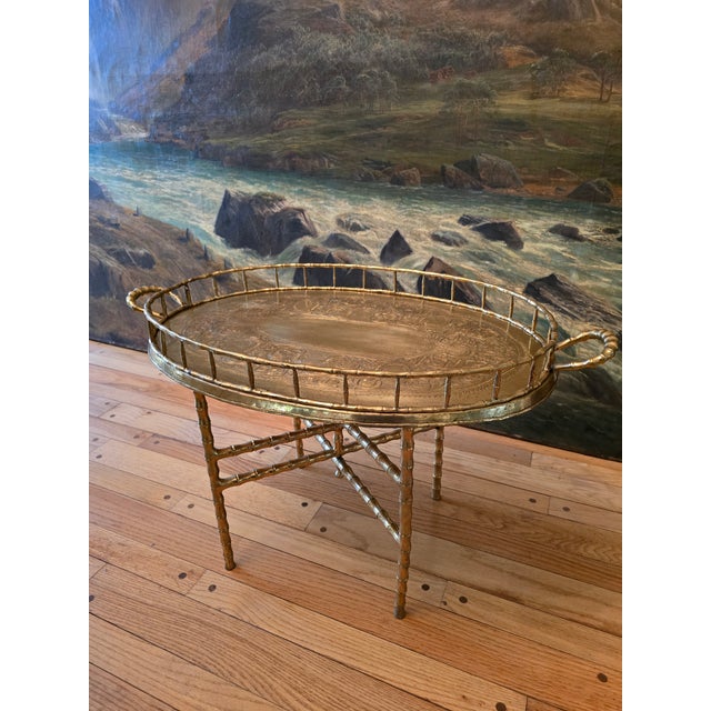 A good vintage 1970s original mid century modern Hollywood Glamour Regency brass cocktail / occasional table . Having a...