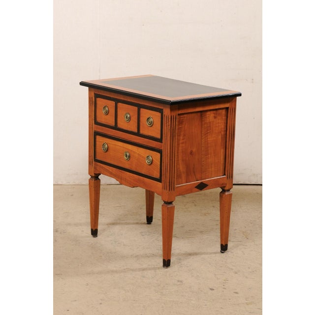 An American wood-carved raised side chest with drawers, circa 1960's. This mid-century commode was created "from the work...