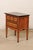 An American wood-carved raised side chest with drawers, circa 1960's. This mid-century commode was created "from the work...