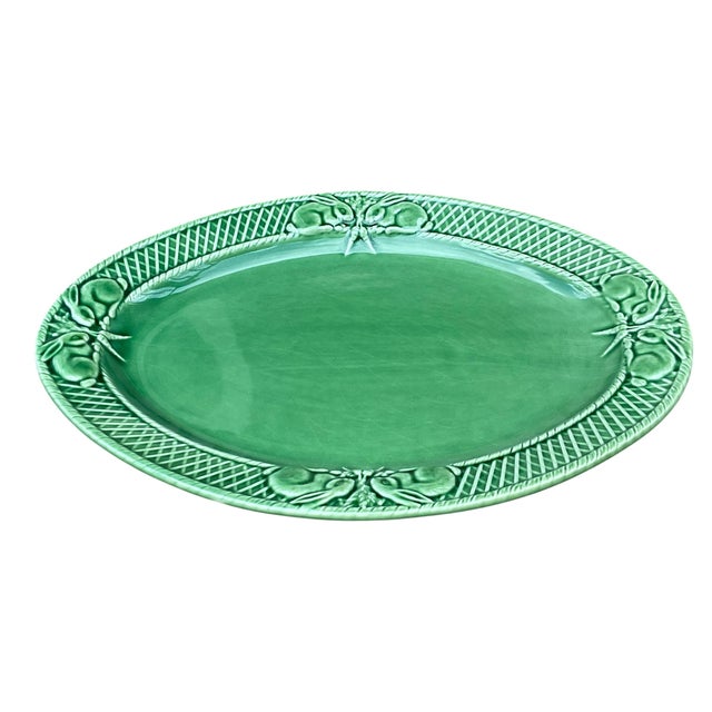 This lovely classic vintage green glazed Majolica rabbit platter is made in Portugal by Bordallo Pinheiro. With a basket-...