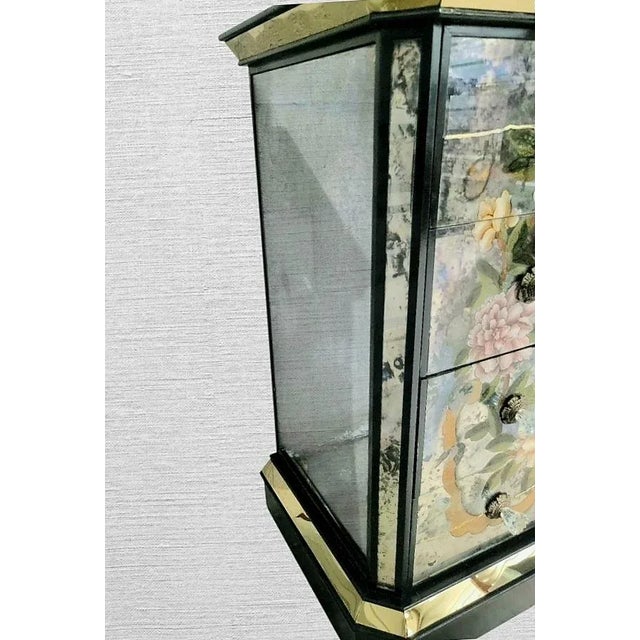 An incredible pair of very rare oversized Chinoiserie Verre Eglomise reversed Hand painted 4 drawer mirrored commodes. The...