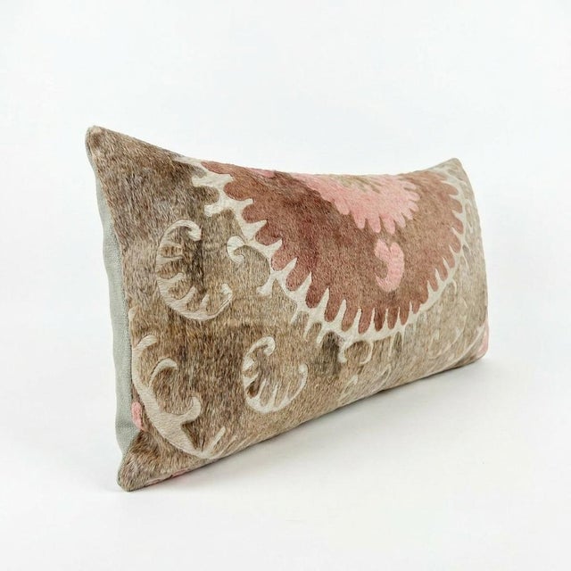 This beautiful 16'' x 35'' hand-embroidered Suzani pillow cover was made from authentic Uzbek cotton fabric. The intricate...