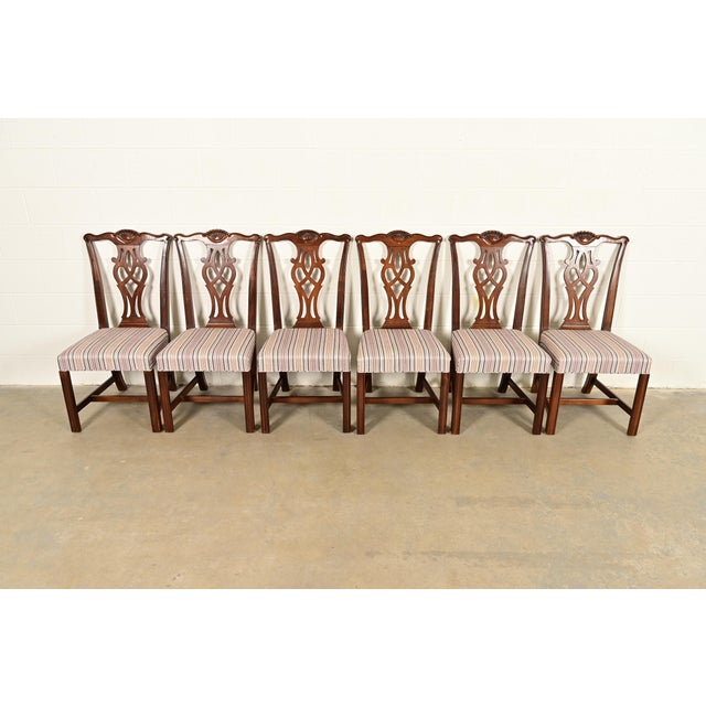 An outstanding set of six Chippendale or Georgian style dining chairs By Drexel Heritage USA, Circa 1980s Carved solid...