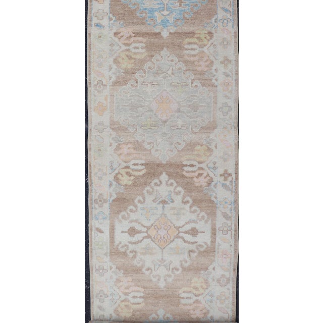 Textile Long Turkish Oushak Runner With Pale Blue, Soft Yellow, and Light Brown Motifs For Sale - Image 7 of 13