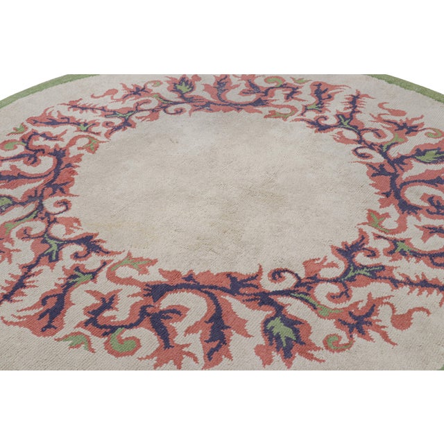 Made with hand-knotted wool in France circa 1940-1950, this 7x7 vintage French Art Deco rug is an extremely collectible...