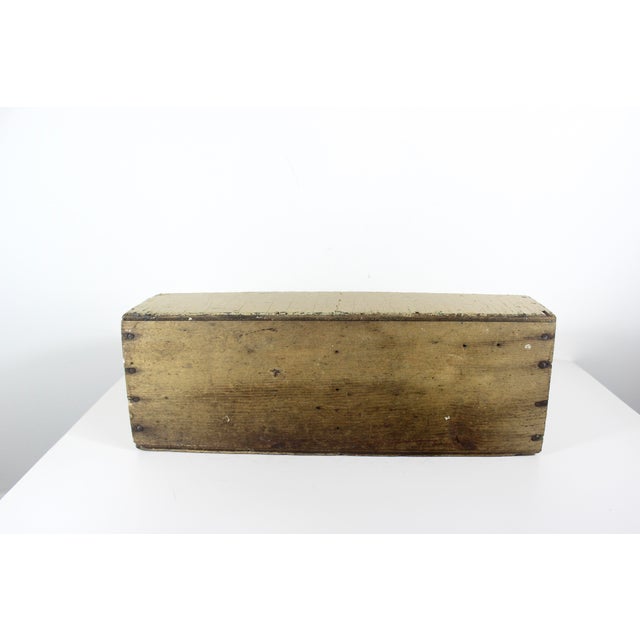 This is a vintage wood trug tool box with a handle. It has been painted multiple times and is chippy, showing the old wood...