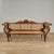 British colonial 19th century Anglo Indian settee handcrafted in teak in an elegant Empire form featuring caned sides,...