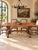 Crafted from solid white oak and dating approximately to 1920–1940, this Spanish dining table brings the character of...