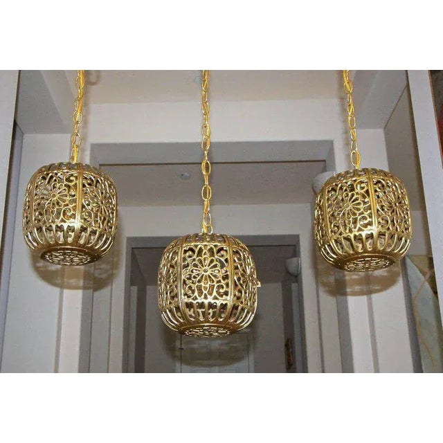 Trio (3) of high quality Asian pierced brass pendant ceiling lights. Newly wired with new hardware including socket, chain...
