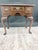 A Councill Craftsmen Queen Anne style lowboy — flame-veneered top with satinwood crossbanding and fan inlay, three drawers...