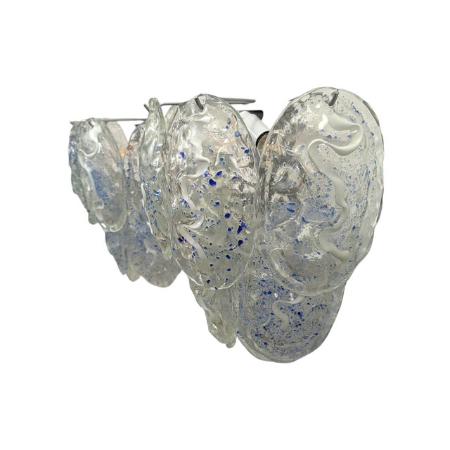 This stunning pair of Murano glass sconces represents a refined example of Venetian craftsmanship, characterized by a...