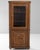 Carved oak vitrine cabinet in Warm Honey Oak. Finished in warm honey oak, this carved oak vitrine cabinet is distinguished...